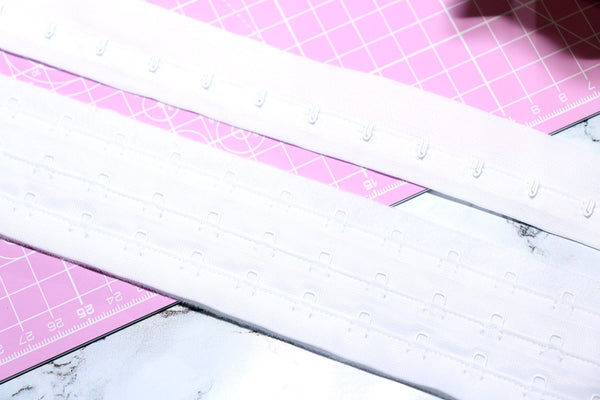 white continuous hook and eye tape. white corsetry tape
