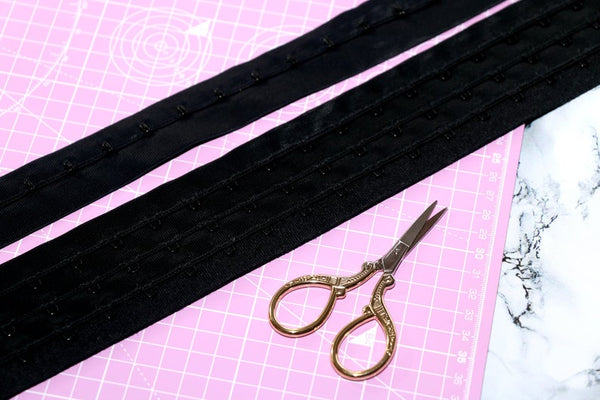 corsetry black hook and eye tape.