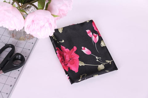 intense pink floral and black background satin charmeuse. Fabric for loungewear, lingerie and bra making.